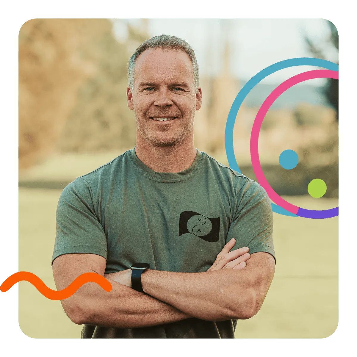 Portrait of the founder, arms crossed, smiling outdoors